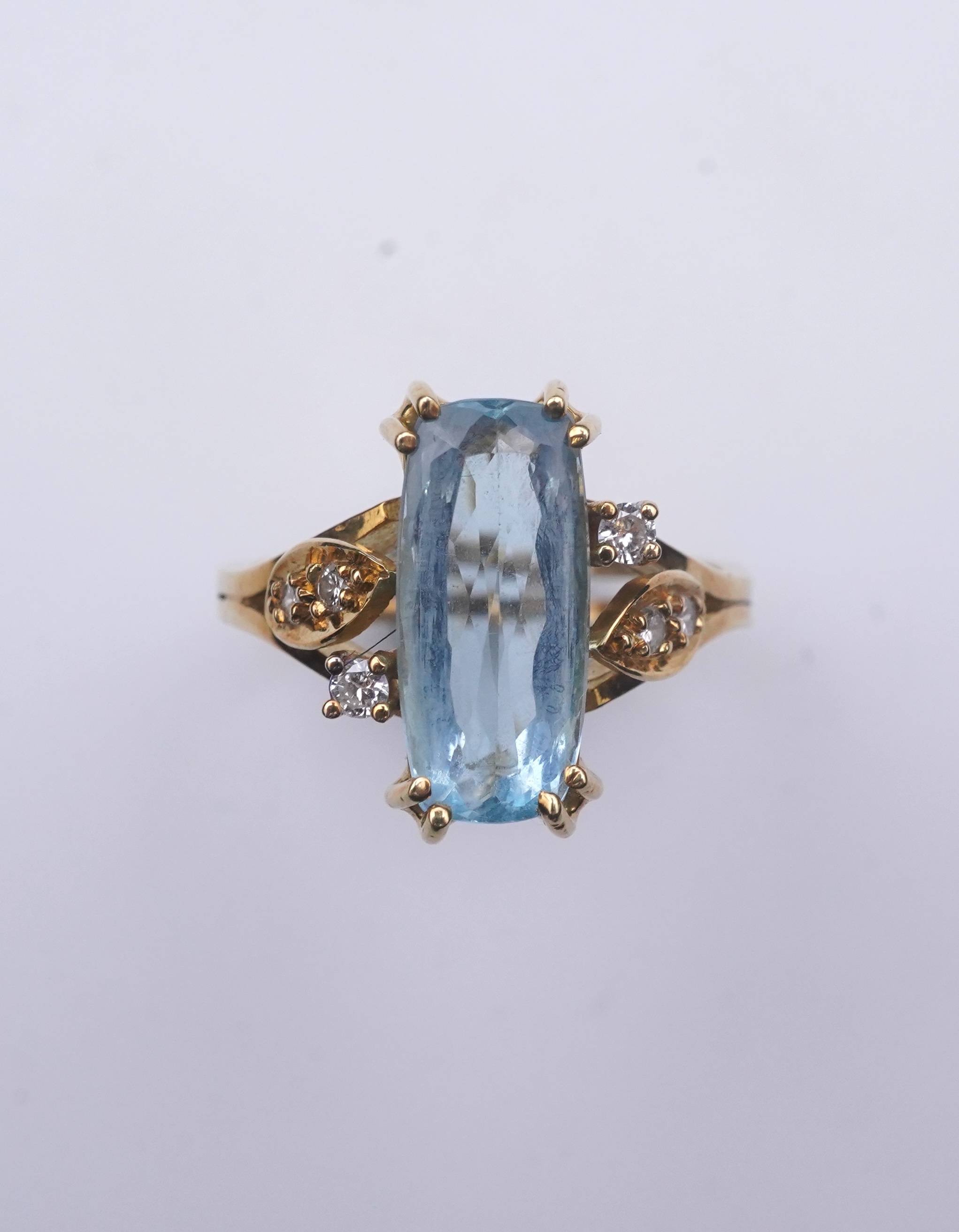 An aquamarine and diamond ring